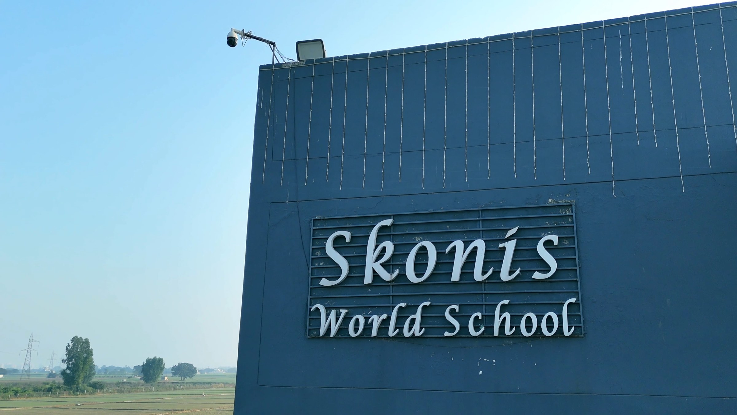 The Skonis World School sign on the school building